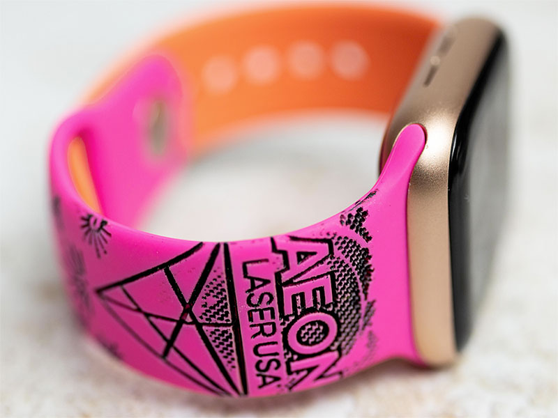 custom fluorecent pink watch band with 一本一道久久综合狠狠躁 logo engraved on it