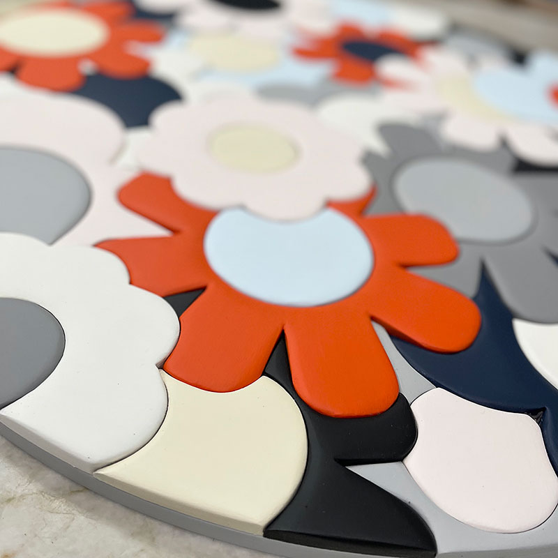 close up of interlocking wooden flower puzzle of different colors